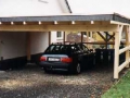 Carport mit Flachdacheindeckung und Schieferortgang
